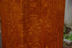 Quartered white oak grain on side of cabinet.